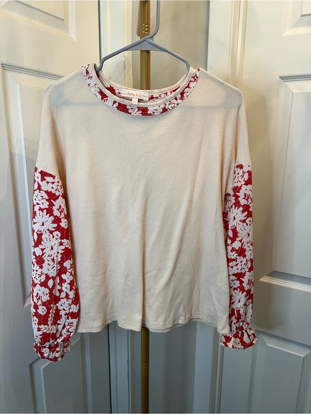 Cream Pullover Top with Red Floral Sleeve Accents